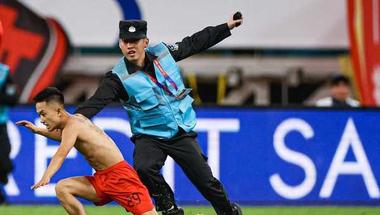 Fan's Pitch Invasion Disrupts China vs Japan World Cup Qualifier