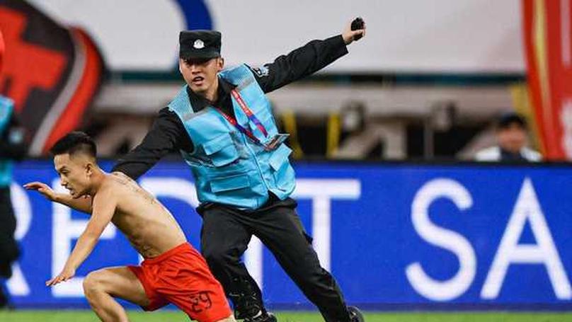 Fan's Pitch Invasion Disrupts China vs Japan World Cup Qualifier